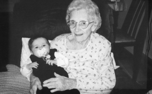 My great-grandmother holding my daughter.